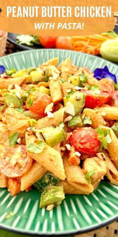 a green plate topped with pasta covered in sauce and toppings next to other food items