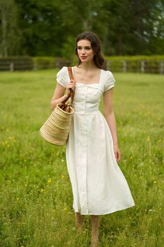 This vintage inspired midi button-down dress is crafted from sustainable linen, a lightweight fabric known for its breathability, durability, and softness. The dress features capped sleeves, feminine bust detail, and a cinched waist that gives way to a full skirt, accentuating your curves and creating a much-loved hourglass silhouette. The models measure: White, olive: 175 cm, size XS; Bright turquoise: 173 cm, size S. *All items labeled with a “P” indicate petite sizing. Sleevless White Dress, Button Down White Dress, Soft Classic Feminine Style, 173cm Woman, Little Women Atelier, Floral Linen Dress, Housewife Outfit Modern, Catholic Dress, Casual Red Dress