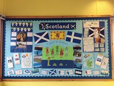 a bulletin board with pictures and flags on it