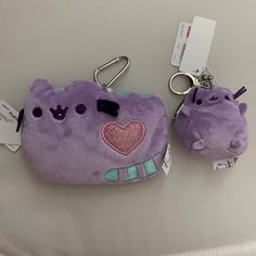 Pusheen Cat Plush Id Lanyard *New With Tags *Lavender Pusheen Cat Plushy Id Case *Clear Id Window Slot On The Back *Retractable Silver-Tone Carabiner *Approximate Dimensions: 5" X 3.5" Pusheen Cat Push Coin Key Ring *New With Tags *Mini Lavender Pusheen Cat Plushy Coin Key Ring *Silver-Tone Kiss Lock Closure *Silver-Tone Lobster Clasp *Approximate Dimensions: 2.75" X 2.5" Pusheen Keychain, Pusheen Cat Plush, Pusheen Unicorn, Cat Key, Id Lanyard, Pusheen Cat, Cat Keychain, Cat Merchandise, Cat Plush