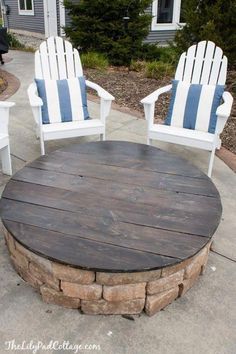 two white chairs sitting next to each other near a fire pit on a sidewalk with the caption battery power 8 % charge your phone