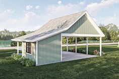 a small green shed sitting on top of a lush green field