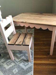 a wooden table and chair sitting next to each other