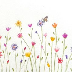 a watercolor painting of wildflowers and a bee