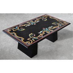 a black table with colorful designs on it