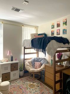 a bedroom with bunk beds and a rug on the floor