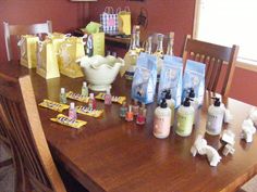 a wooden table topped with lots of bottles and bags