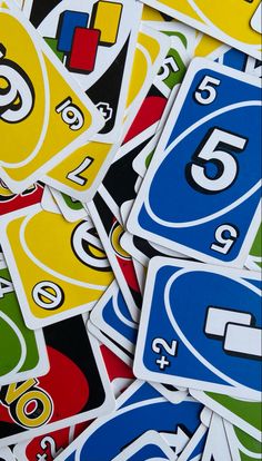 many different colored stickers with numbers and symbols on them, all in the same pattern