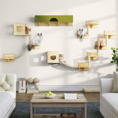 a living room filled with white furniture and lots of cats on the shelves above them