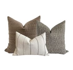 three pillows with different patterns on them