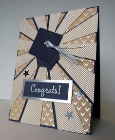 a graduation card with congratulations written on the front, and an image of a graduate's cap