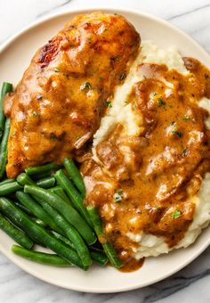 Using pantry staples you can make this ridiculously tasty smothered chicken recipe! It's got a rich, perfectly seasoned gravy that's made from scratch and juicy pan-friend chicken. Chicken Sauce, Think Food, Chicken Dishes Recipes