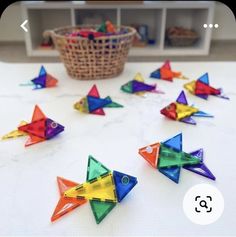 colorful origami fish are arranged on the table