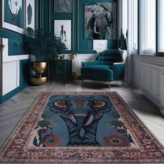 an elephant rug is in the middle of a room with green walls and pictures on the wall