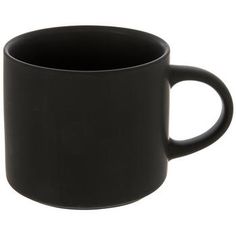 a black coffee mug sitting on top of a white table