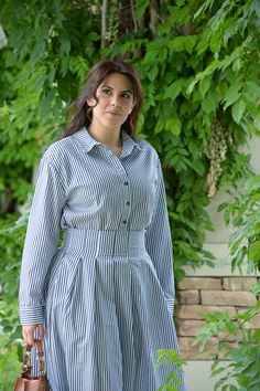 Stripes and summer go hand in hand! Top runs loose Full buttoned front Can be worn out or tucked in like model Skirt has side zipper no elastic Skirt has nice pleated waist Fabric does not stretch Imported from Turkey 65% Cotton/35% Polyester Modeled in small 5'6" paired with red belt not included Small - 42 (bust 44”/waist 32”) Medium - 44 (bust 46”/waist 34”) *To measure yourself: Bust - measure the widest part of your bust with your bra on. Waist - measure the most narrow part (usually bellyb Simple Dress Styles, Elastic Skirt, Lipstick Kit, Fall Winter Dresses, Red Belt, Ankle Length Dress, Loaf Cake, Skirt Belt, Swim Skirt