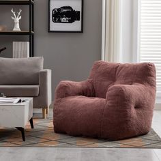 a living room with two chairs and a coffee table