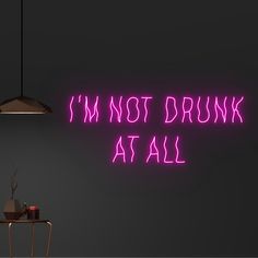 a neon sign that says i'm not drunk at all