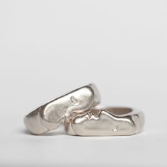 Oxbow's signature Kiss Rings come as a set of two. You can select two of the same size if you intend to wear them together, or choose two different sizes if you want to gift one or wear them on different fingers. Ring one is pictured on the bottom of the first photo & is the face with the nose. Details: Solid sterling silver rings Original design carved in wax and cast Signet style *please note, the kiss rings have a thick band, and most people prefer to size up by 1/2 size. This is just a note, Organic Rings Engagement, Rings Silver, The Kiss, The Nose, Signet Ring, First Photo, Unique Rings, Original Design, The Face