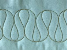 four circles are stitched together on the fabric