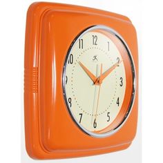 an orange square clock with numbers on the face and hands is shown in front of a white background