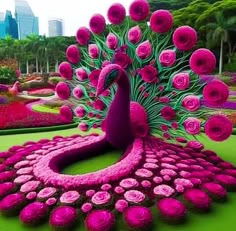 there is a peacock made out of flowers