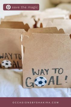 some brown bags with soccer balls on them and the words way to goal written on them