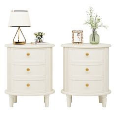 two white nightstands sitting next to each other