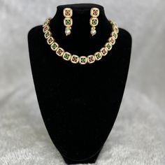 Beautifully crafted Kundan style choker and earrings in Red and Green with golden finish. LINK IN BIO #indian #indianwedding #indianbride #jewellery #jewelry #jewelleryset #earrings #kundan #elegant #choker #imitationjewellery #imitationpearls Earrings Kundan, Elegant Choker, Indian Bride, Indian Wedding, Link In Bio, Choker