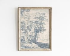 a painting hanging on the wall next to a white wall with a tree in it