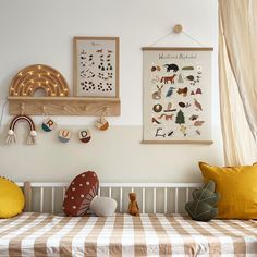 a child's room with toys and artwork on the wall