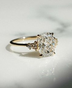 a diamond ring with three stones on it