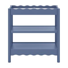 a blue wooden shelf with scalloped shelves on the top and bottom, against a white background