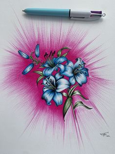 a drawing of blue flowers on a white paper with a marker pen next to it