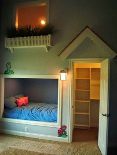 there is a bed built into the side of a wall with bookshelves on it