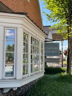 the front of a brick building with large windows and a sign that says fortwood bookshop