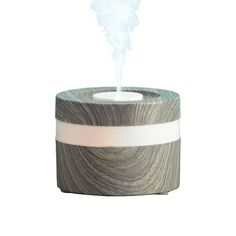 This color changing aromatic diffuser is designed for use with essential oils. Add your favorite fragrance to it and create a relaxing ambience in your living space. Size: 3.86” x 2.83”.  Color: Gray.