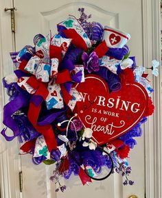 a wreath that says nursing is a work of heart on the front door with purple and red ribbons