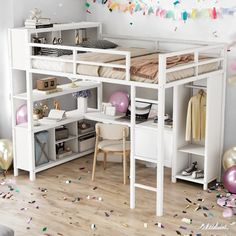 a white loft bed sitting next to a desk with balloons and confetti on the floor