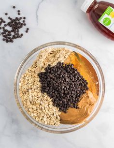 ingredients to make peanut butter and oatmeal smoothie in a glass bowl