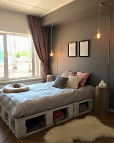 a bedroom with a bed made out of crates