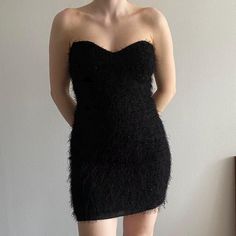 90s fuzzy little black dress LBD by G.L.A.M (Groupe Les Ailes De La Mod), a brand from Quebec that is no longer operating. There isn't a size tag anywhere on the dress, but judging by the fit, I'd say it's a Medium or a 6. Its silhouette is fitted/bodycon with a sweetheart neckline and it rests over the knee/mid thigh on me. Condition is fantastic and its texture is hard to describe. It's fuzzy, but also has shiny material going across it. The 3rd photo shows it best. ✦ MODEL MEASUREMENTS ✦ - Height: 5'5" - Bust: 34C - Waist: 29" - Hip: 39" - Wears US 6/UK 10 #lbd #black #formal #vintage #90s short mini 1990s nineties glam black tie nye holiday flapper lbd club nye christmas winter party unique Black Strapless Dress, Black Formal, Winter Party, Best Model, Dress Clothes For Women, Black Tie, Model Measurements, Over The Knee, Sweetheart Neckline