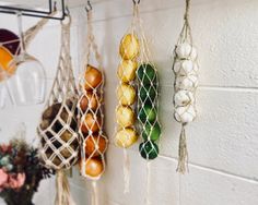 hanging fruit and vegetable baskets on a wall