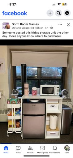 a small kitchen with an appliance and refrigerator