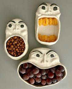 three bowls with fruit in them and faces made to look like people's mouths