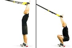 the man is doing an exercise with a pull - up bar in his hands and knees