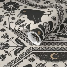 a black and white wallpaper with an animal design