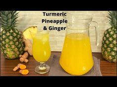 there is a pitcher of pineapple and ginger next to two glasses of orange juice