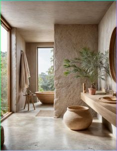 a bathroom with a tub, sink and large window