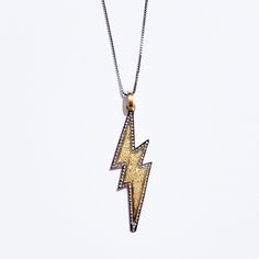 This bold design necklace is a symbol of energy to remind you of your strength. Wear it solo, or team it with other layer pieces to make your modern style. MATERIALS: 925 Sterling Silver, 18K Gold, DiamondsPENDANT: Lightning bolt charm, 1.5 inchNECKLACE LENGTH: 18 Inches longSTONE: Natural Diamond, 0.39 ctCHAIN: Box with spring ring claspSTYLE: MinimalistDESIGNED: Joyfulmuze Atomic County, Lightning Necklace, Lightning Bolt Necklace, Lighting Bolt, Bold Jewelry, Jeremy Scott, Necklace Box, Lightning Bolt, Bold Design